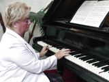 stylish gilf plays the piano and then with her nipples
